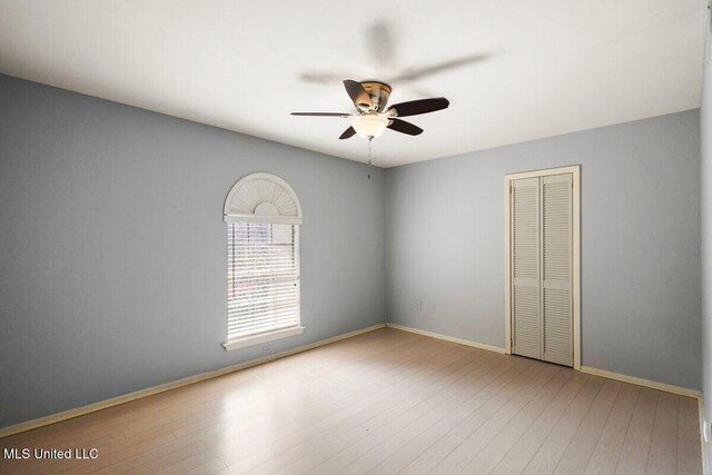 5155 Wayneland Dr Unit F6, Jackson, MS 39211 - empty room with a ceiling fan, wood finished floors, and baseboards