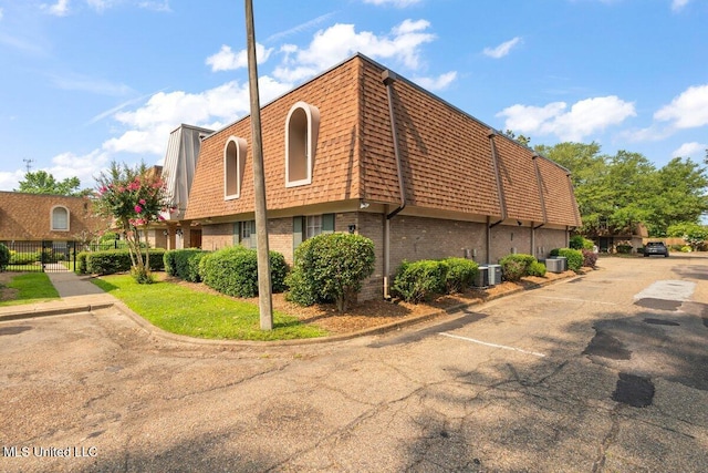 5155 Wayneland Dr Unit F6, Jackson, MS 39211 - view of property featuring uncovered parking and central AC unit