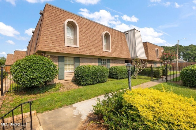 5155 Wayneland Dr Unit F6, Jackson, MS 39211 - view of front of home with brick siding, mansard roof, and roof with shingles