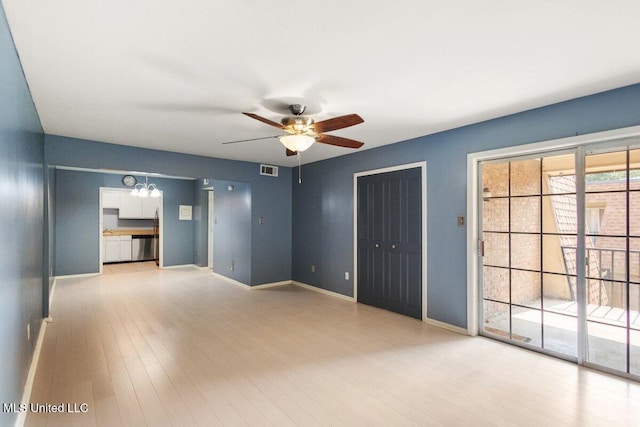 5155 Wayneland Dr Unit F6, Jackson, MS 39211 - unfurnished living room with ceiling fan, baseboards, light wood finished floors, and a chandelier