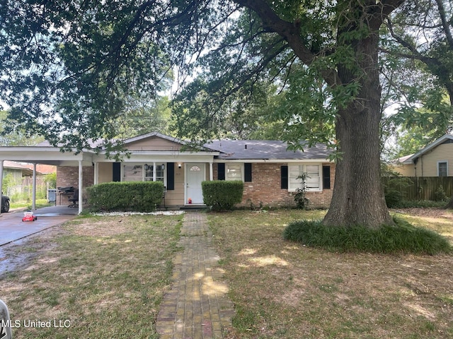 single story home with a front yard and a carport