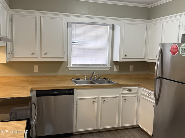 kitchen with sink, white cabinets, and appliances with stainless steel finishes