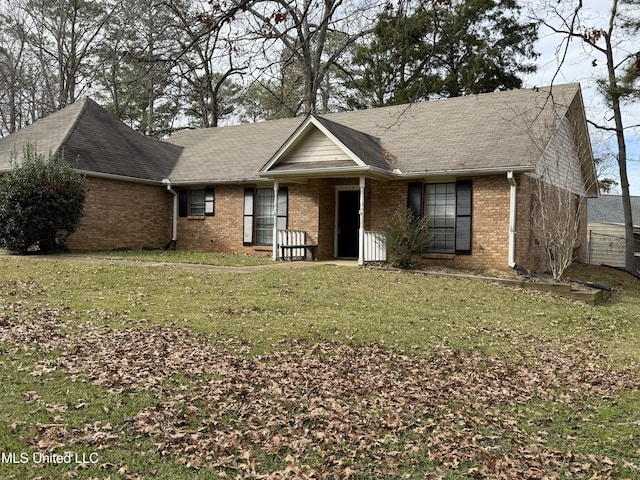 single story home featuring a front yard