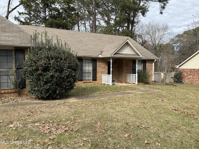 ranch-style house featuring a front lawn