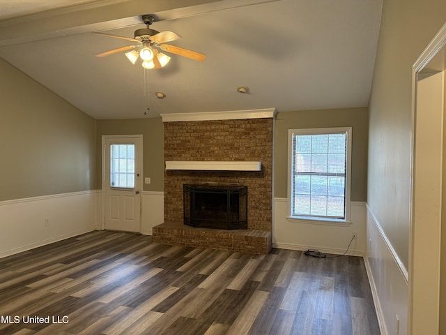 unfurnished living room with ceiling fan, dark wood-type flooring, a brick fireplace, and lofted ceiling