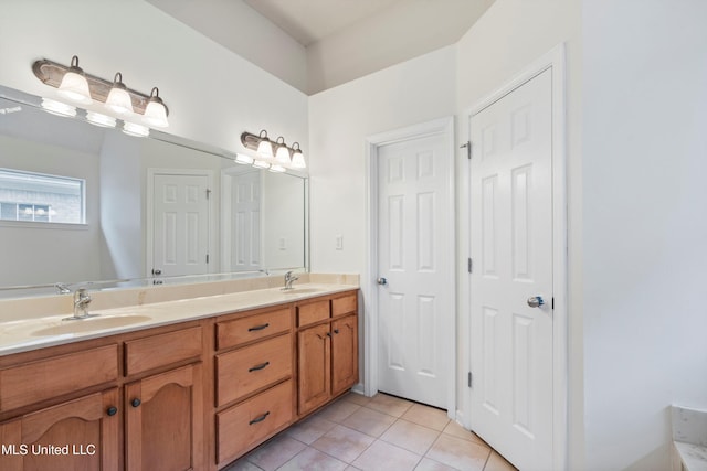 bathroom featuring tile patterned floors and double vanity
