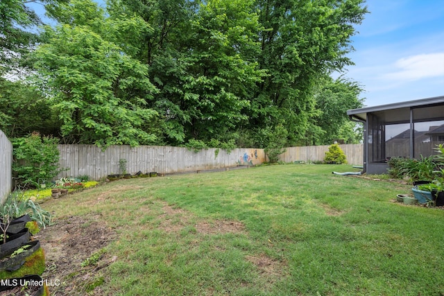 view of yard featuring a sunroom
