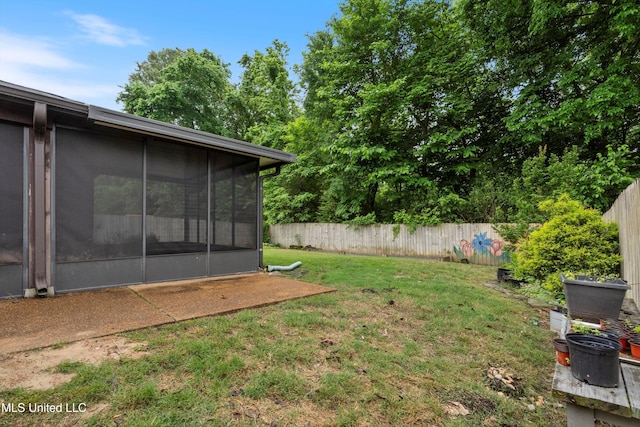 view of yard featuring a sunroom