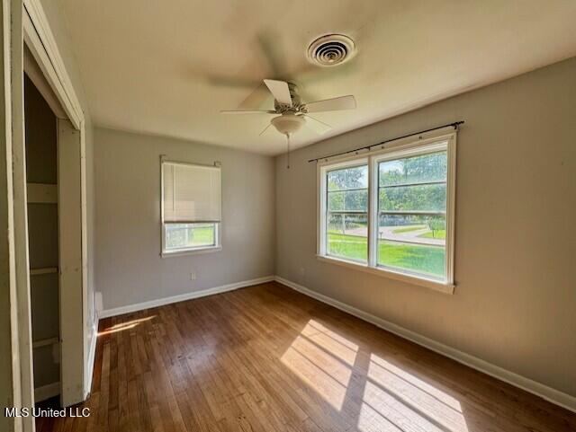 106 Laurel Ave, Natchez, MS 39120 - empty room featuring wood finished floors, baseboards, and a ceiling fan