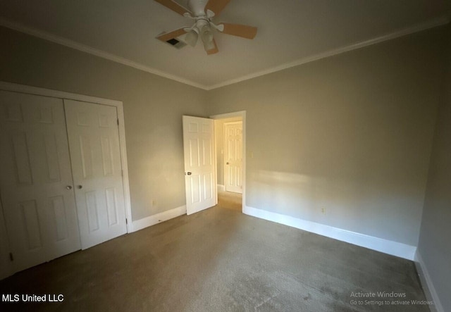 unfurnished bedroom with a ceiling fan, visible vents, baseboards, ornamental molding, and a closet