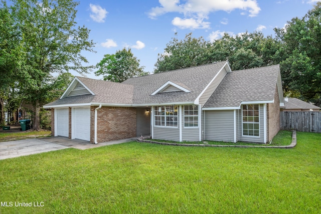 single story home with a front yard and a garage