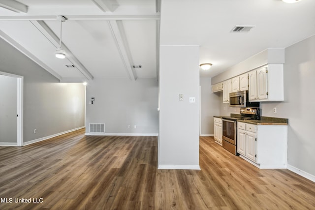 92 Hunter Dr, Ocean Springs, MS 39564 - kitchen with stainless steel appliances, open floor plan, dark countertops, light wood-style flooring, and baseboards