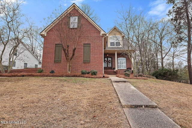 view of front property featuring a porch and a front yard