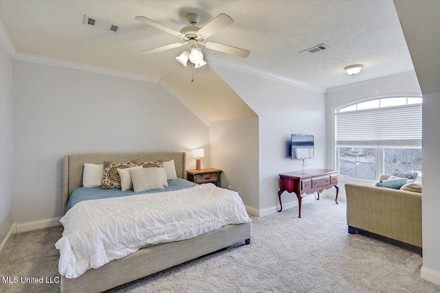 carpeted bedroom featuring a textured ceiling, ceiling fan, crown molding, and lofted ceiling