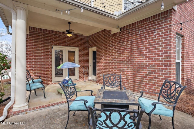 view of patio featuring ceiling fan