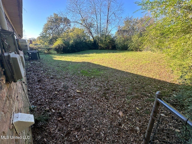 view of yard featuring central AC unit