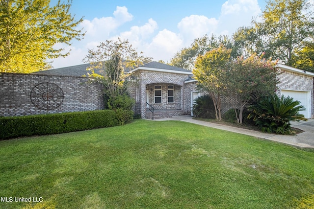 view of front facade featuring a front yard and a garage