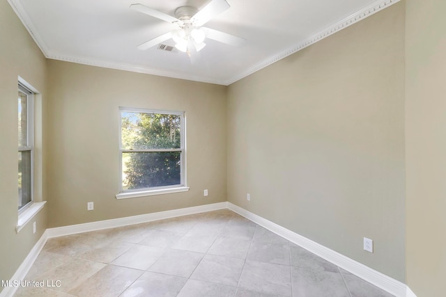 tiled spare room featuring ceiling fan and ornamental molding