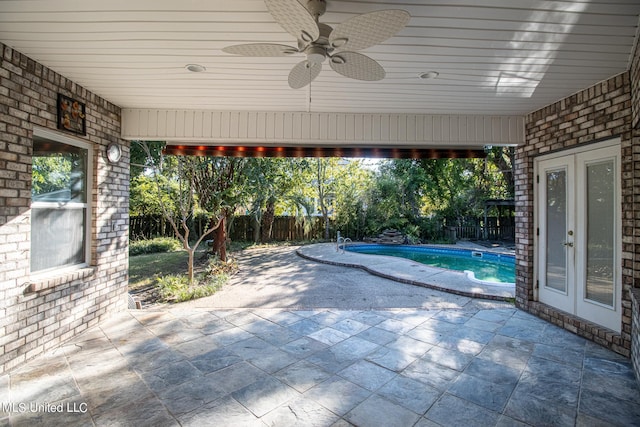 view of patio featuring ceiling fan and french doors