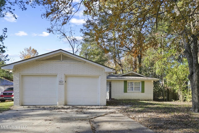 ranch-style home with a garage