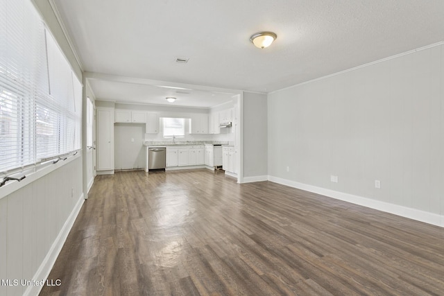 unfurnished living room with ornamental molding and dark wood-type flooring