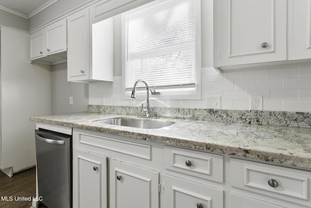 kitchen featuring white cabinetry, sink, dishwasher, and ornamental molding