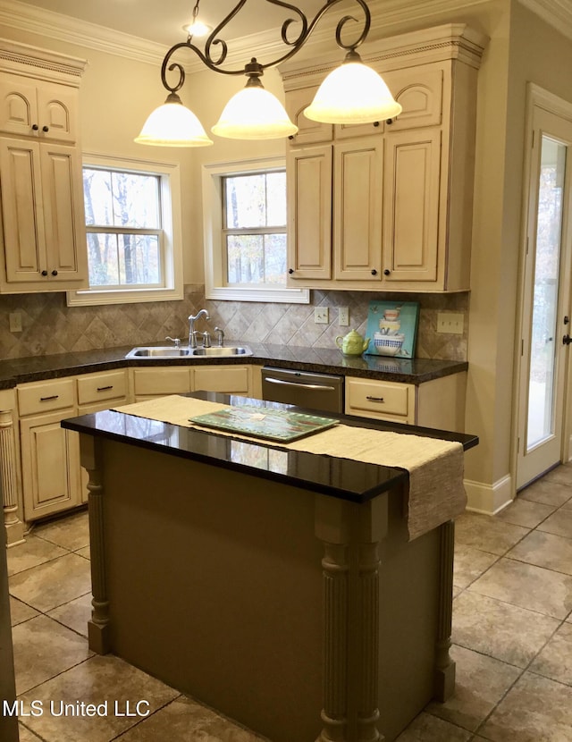 kitchen with sink, a center island, pendant lighting, and decorative backsplash