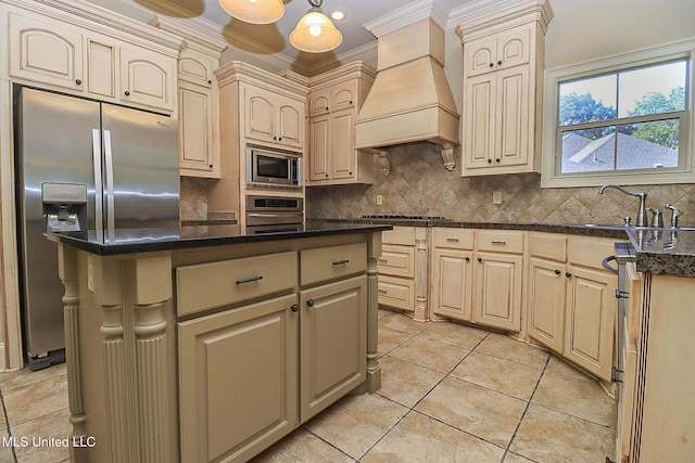 kitchen featuring a center island, custom exhaust hood, crown molding, appliances with stainless steel finishes, and hanging light fixtures