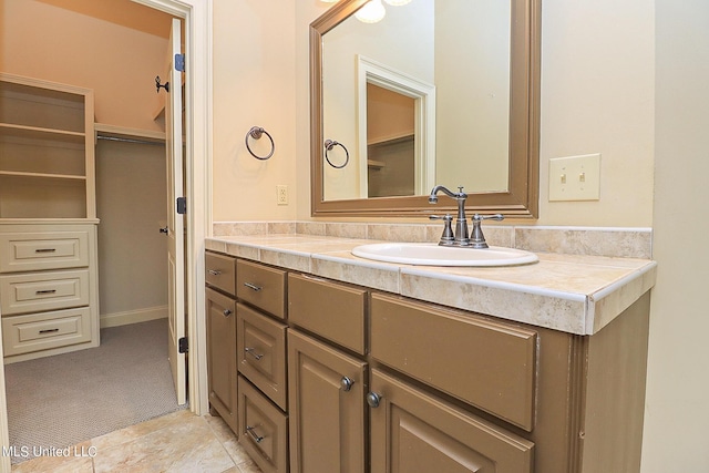 bathroom with vanity and tile patterned flooring