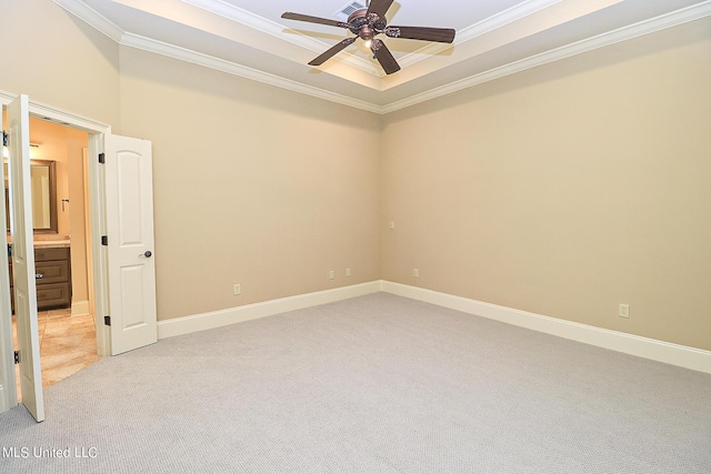 carpeted empty room with ceiling fan and ornamental molding