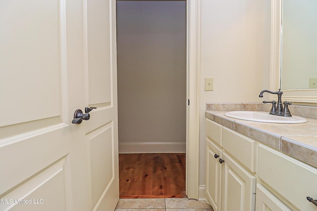 bathroom with wood-type flooring and vanity