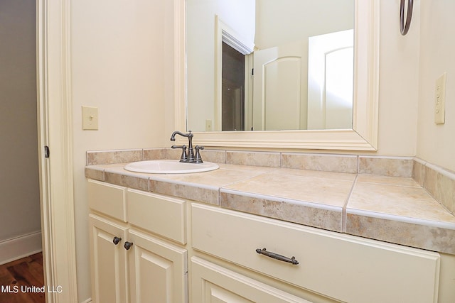 bathroom with vanity and wood-type flooring