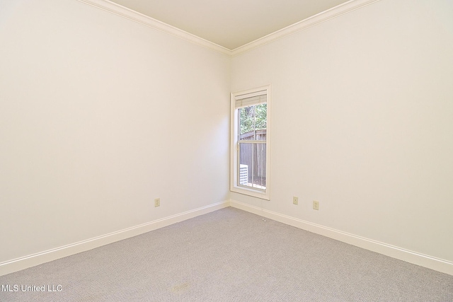 unfurnished room with light carpet and ornamental molding