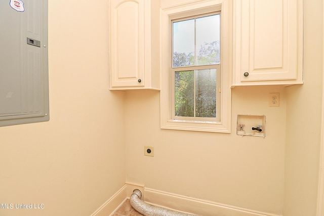 laundry area featuring washer hookup, cabinets, electric dryer hookup, and a healthy amount of sunlight