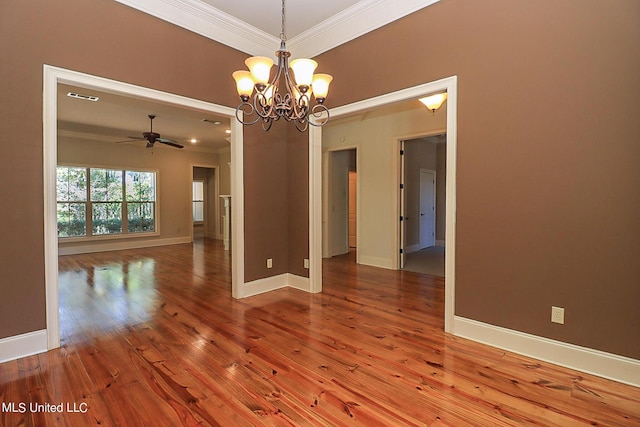 empty room featuring crown molding, hardwood / wood-style flooring, and ceiling fan with notable chandelier