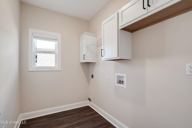 washroom featuring hookup for an electric dryer, hookup for a washing machine, dark hardwood / wood-style floors, and cabinets