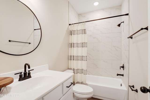 full bathroom featuring vanity, toilet, and shower / tub combo with curtain