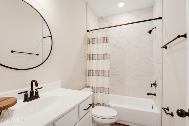 bathroom featuring shower / bathtub combination with curtain, vanity, and toilet