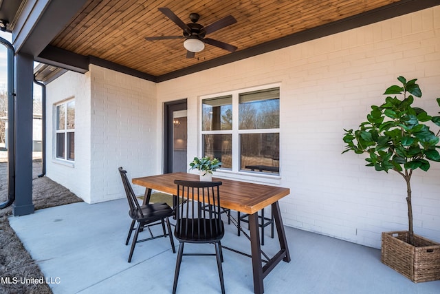 view of patio / terrace with a ceiling fan and outdoor dining area