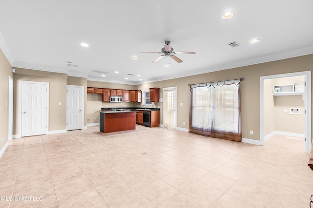 kitchen featuring ceiling fan, a center island, black dishwasher, ornamental molding, and light tile patterned floors