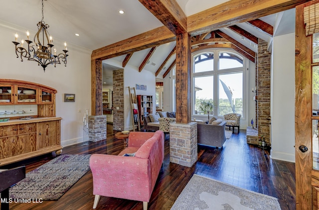 living room with an inviting chandelier, beamed ceiling, baseboards, dark wood-style flooring, and decorative columns