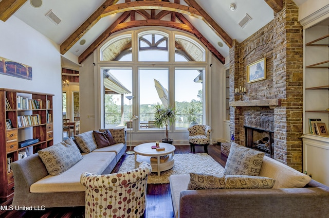 living area featuring plenty of natural light, hardwood / wood-style flooring, and visible vents