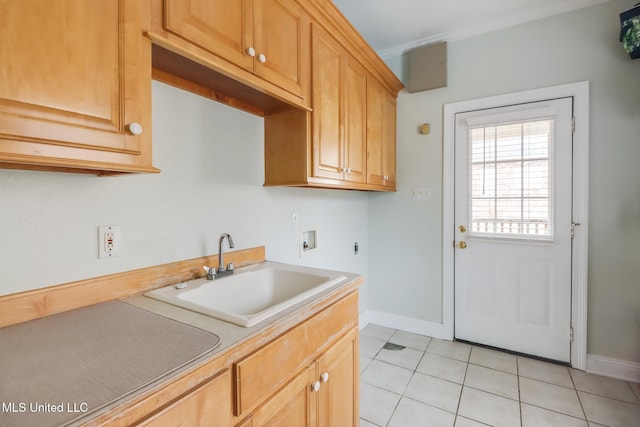 kitchen featuring sink, light brown cabinets, and light tile patterned floors