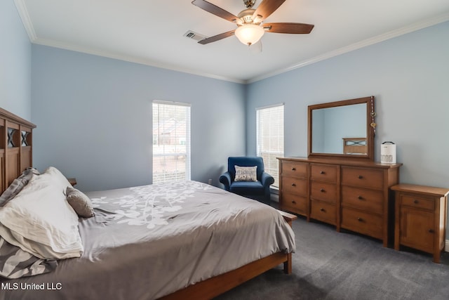 bedroom with ceiling fan, ornamental molding, and dark carpet