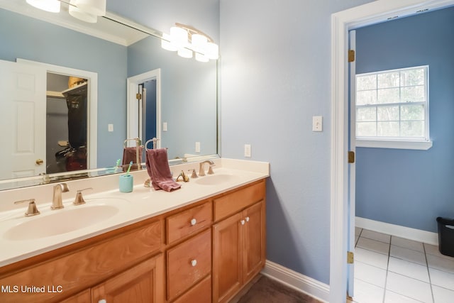 bathroom with tile patterned flooring and vanity