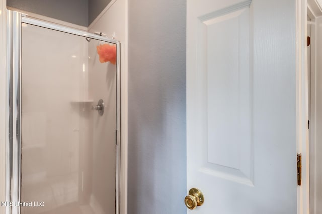 bathroom featuring an enclosed shower