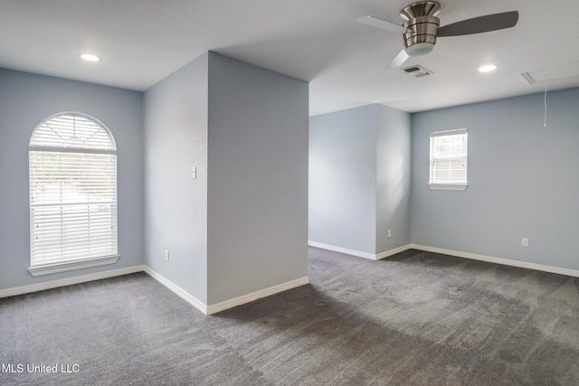 carpeted empty room featuring ceiling fan