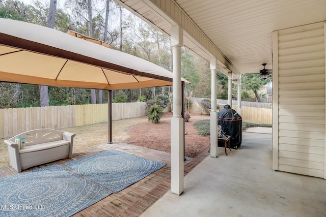 view of patio / terrace featuring a gazebo and ceiling fan