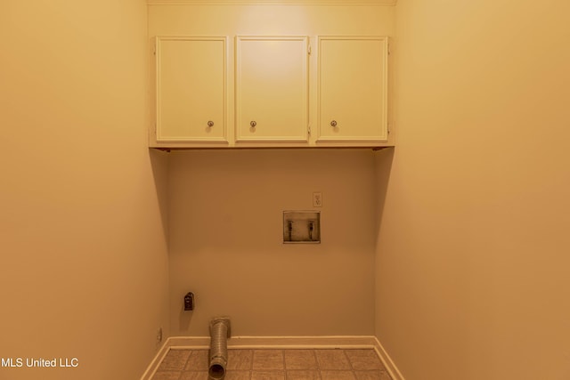 laundry area with cabinet space, baseboards, and hookup for a washing machine