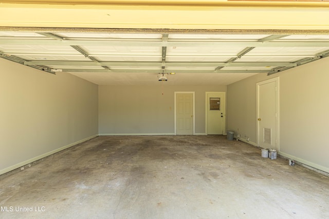 garage with baseboards and visible vents
